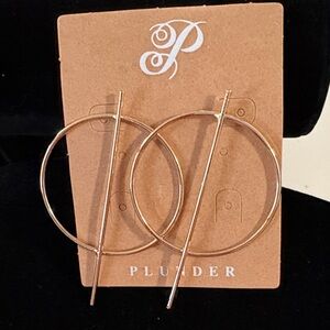 Plunder gold color round earrings.